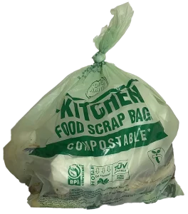 Example of a full green compostable bag filled and tied