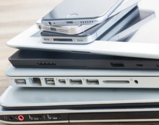 Close up of a stack of laptops and mobil phones; examples of electronic HHW
