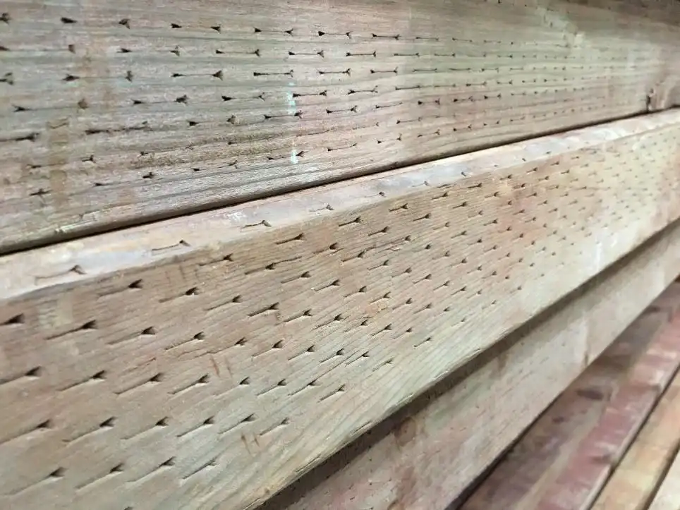 Close up of treated wood; example of HHW