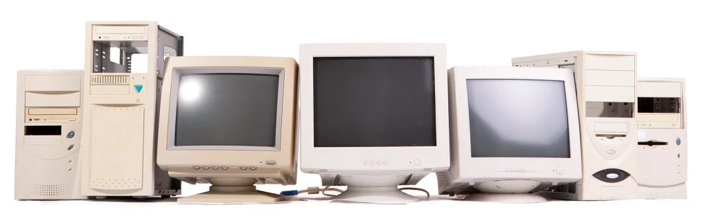 Old computer monitor and desktops in a row, example of business Household Hazardous Waste